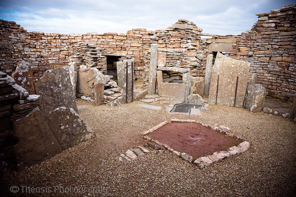 Inside the main broch tower with a large hearth in the middle of the floor.