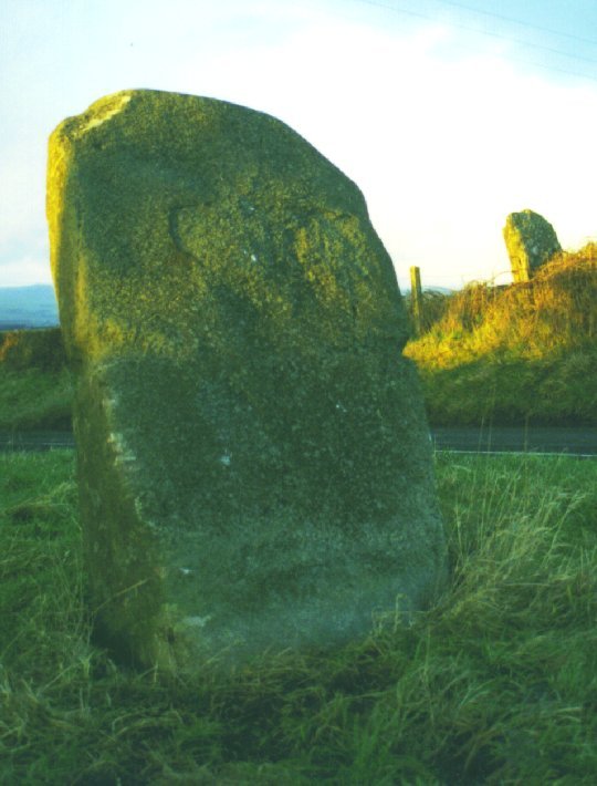  If you're driving down this road and you don't bear left or turn right at this junction, this is the part of the megalith that your bumper would connect with. Which might explain all those scratches and why the stone is at such an odd angle.