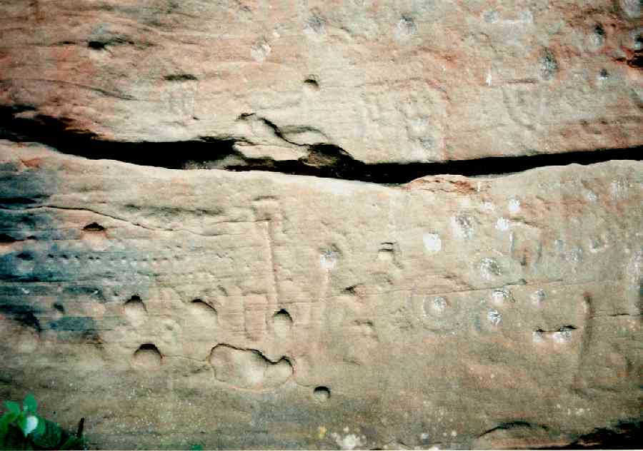  Another view of the left-hand face showing rows of cups and unusual rectangular marks.