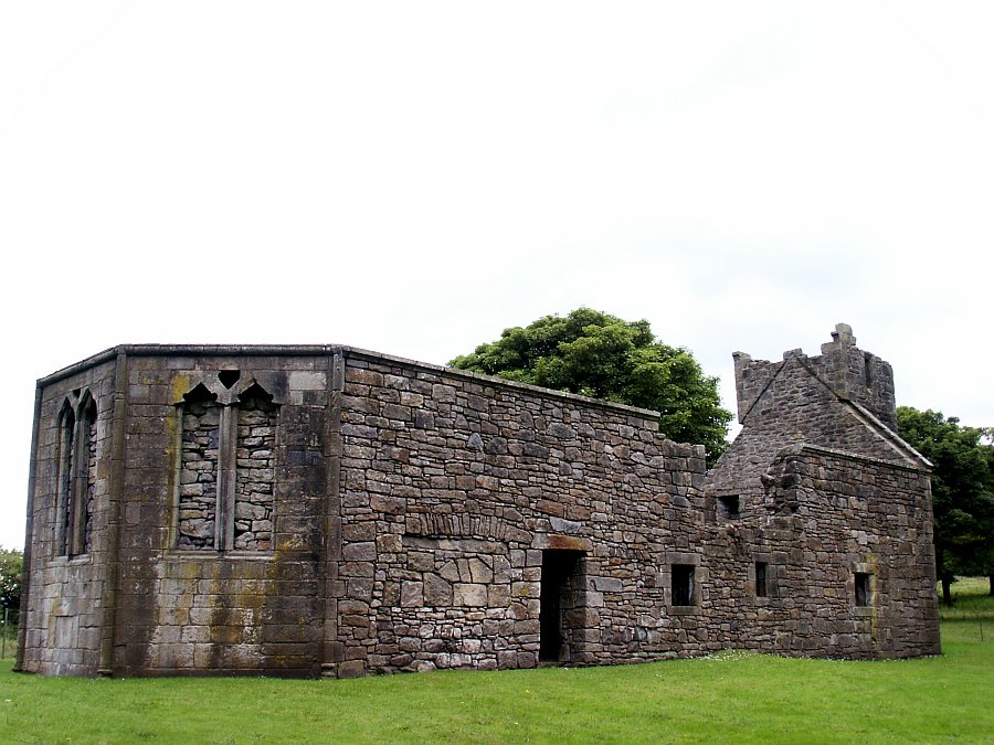 The church from the north west.  The modified section of wall to the left of the doorway shows the location of John Semple's tomb.