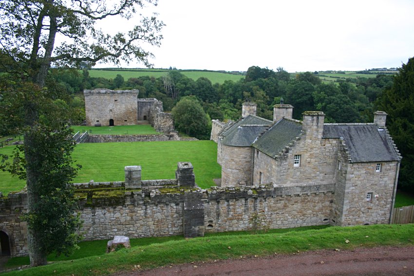 The front curtain wall, 17th century house and 16th century tower keep from the west.