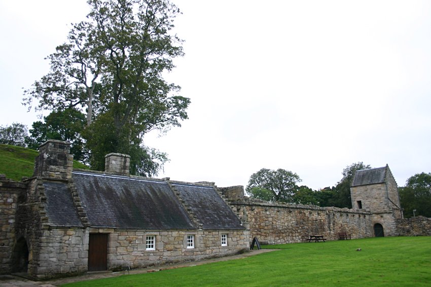 The curtain wall and outbuildings.