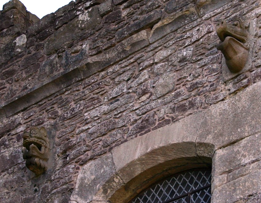 Gargoyle heads on the courtyard-facing wall of the halls.