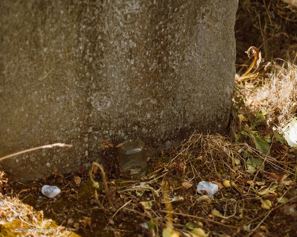 Offerings at the base of the stone.