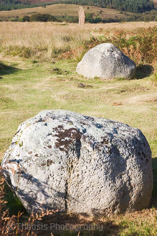 Granite boulders of Circle 4 with the distinctive tall stone of Circle 3 in the background