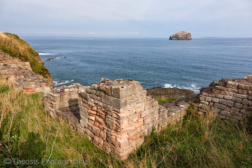Ruined wall and the Bass Rock out to sea.