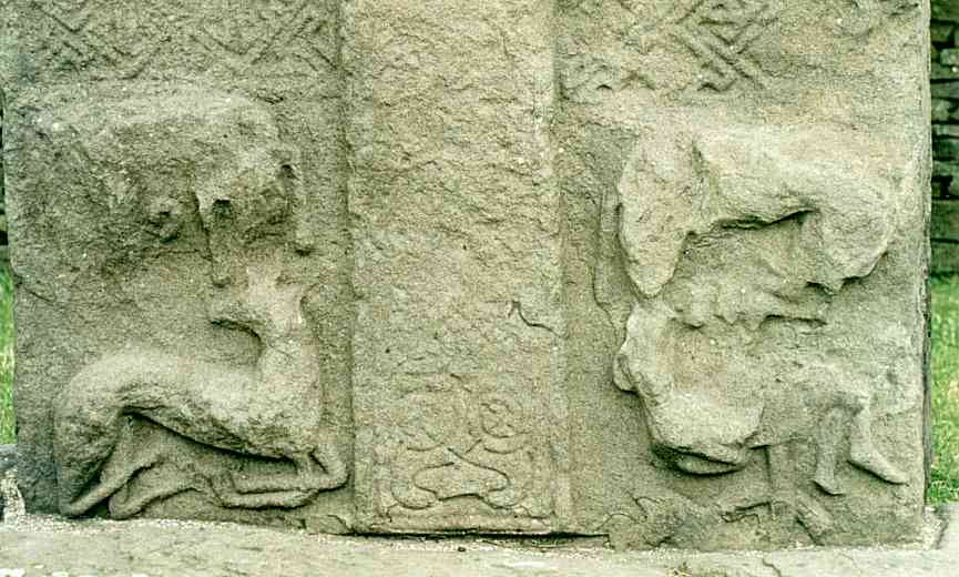 Detail of the Evangelist-creatures at the base of the cross side.