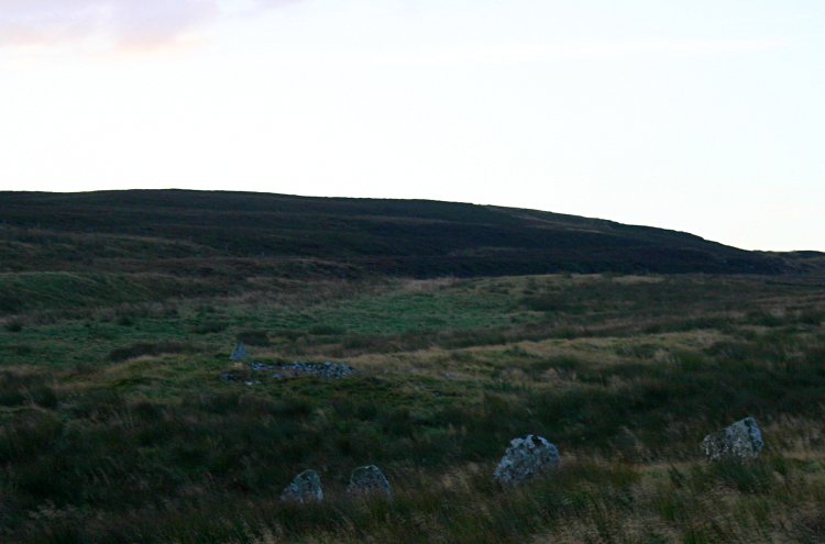 Looking southeast to the nearby chambered cairn.