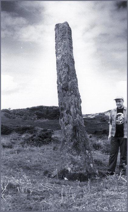 Looking northwest with a 5'9" yardstick.  The remains of Dun Calltuinn stand on the hill just over the yardstick's right shoulder.