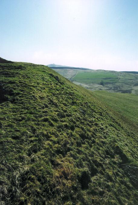 The northwestern side of the fort has fewer man-made defences, having the advantage of a steep slope.  Looking southwest.
