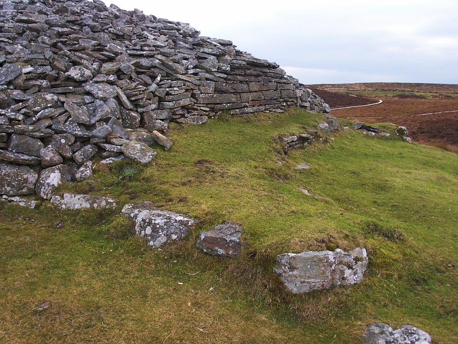 The remains of the southern horned forecourt.  In the distance you can see Camster Round Cairn.