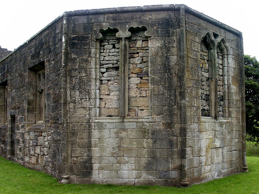 The bricked-up windows in the eastern apse.  Note the different arch styles.
