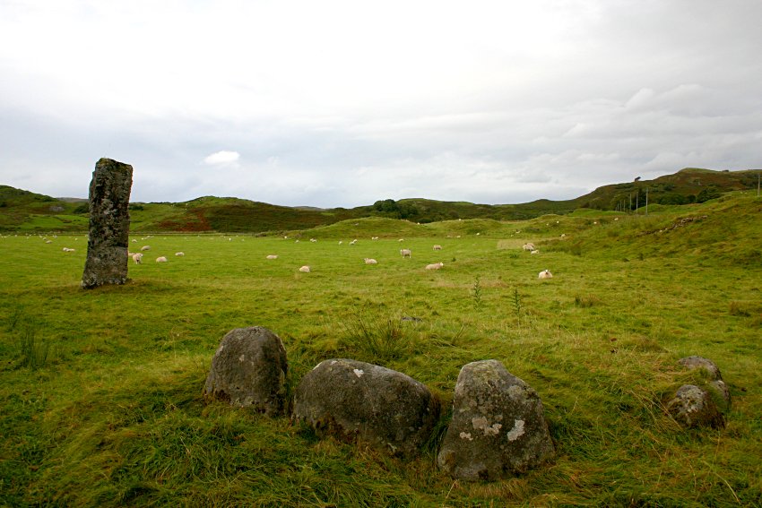 Looking west with the kerb cairn in the foreground.