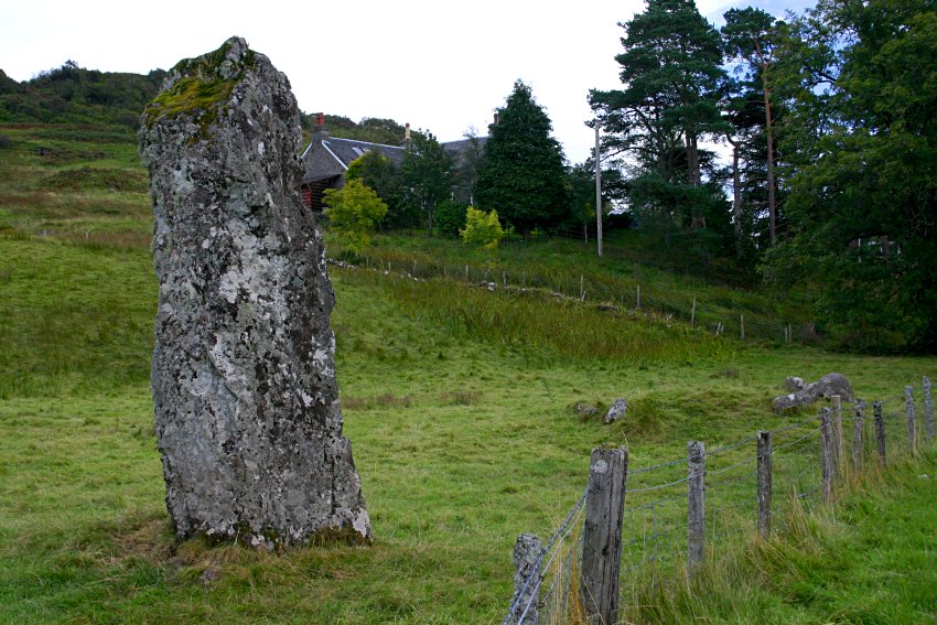 Looking east with the kerb cairn to the right and behind the monolith.
