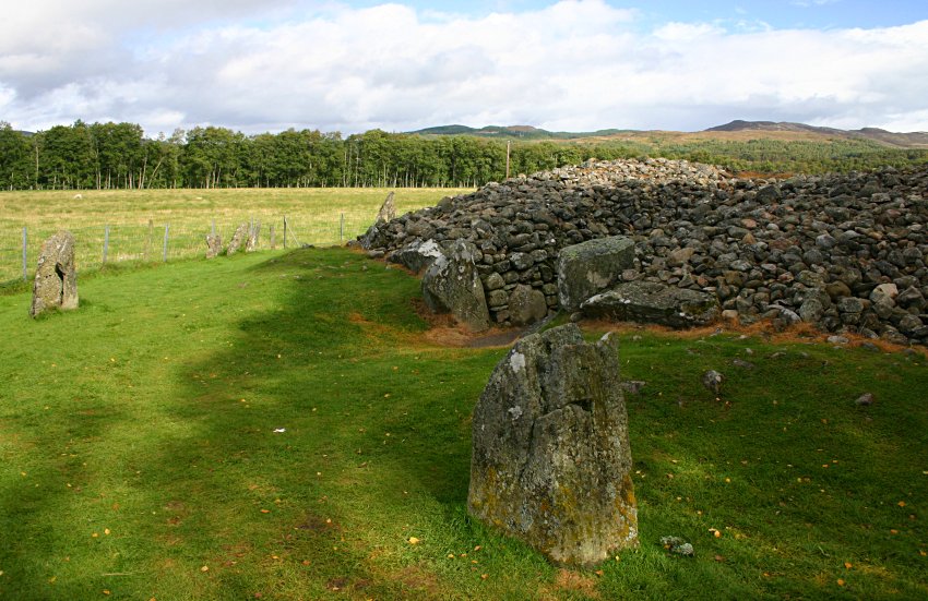 Looking north.  The portal stones of the entrance passageway are immediately behind the standing stone in the foreground.