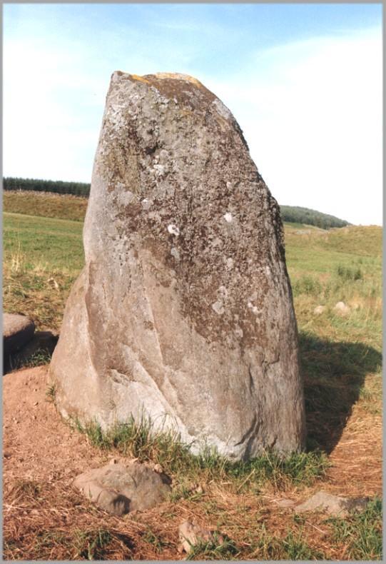Looking northeast.  A group of cup marks can be seen at the lower right of the stone