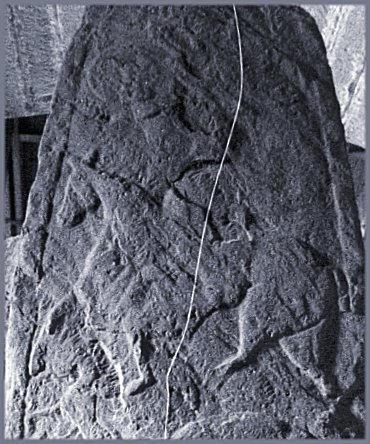 At the top of the stone is a double-disc-and-Z-rod; the left-hand disc can be seen.  Below is a horseman.