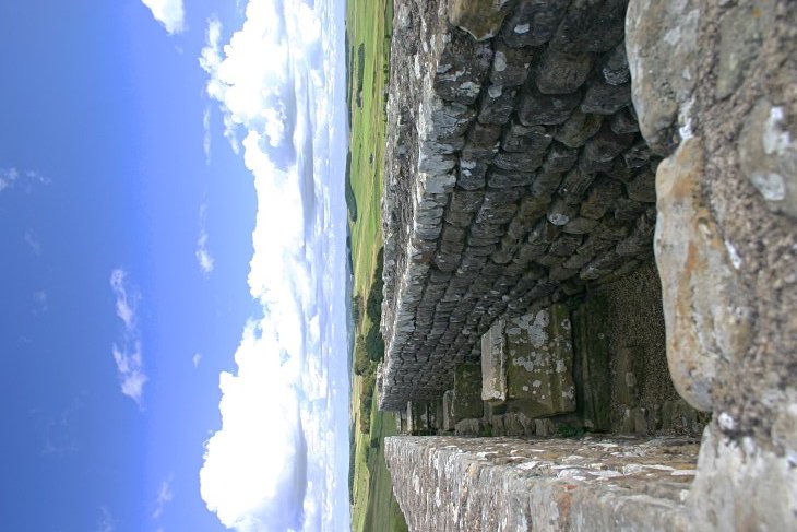 The grannary was originally a single large room with a row of supporting pillars down the centre.  The bases of the pillars can be seen here between partition walls that were added later.