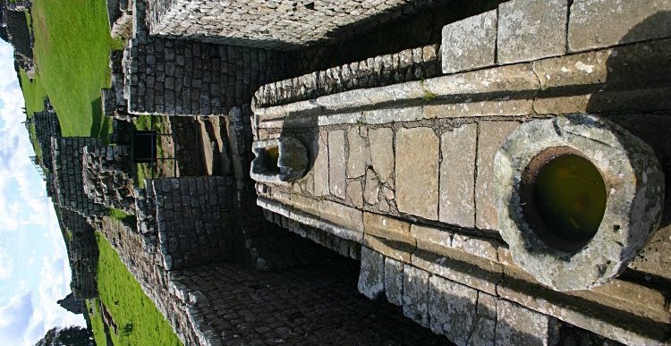 The latrines in the southeast corner with the south gate beyond.
