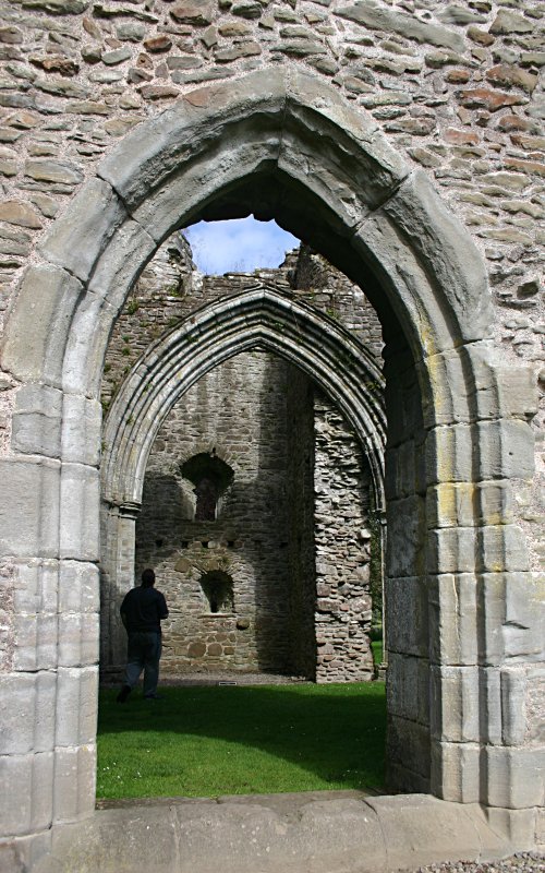 Looking from the west range north into the nave and the bell tower beyond.