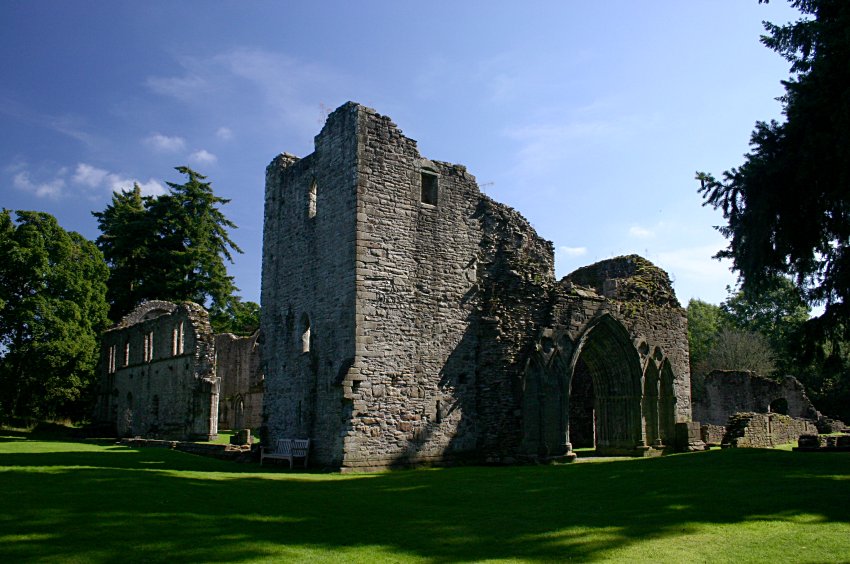 The west entrance, bell tower and north aisle of the church, seen from the northwest.