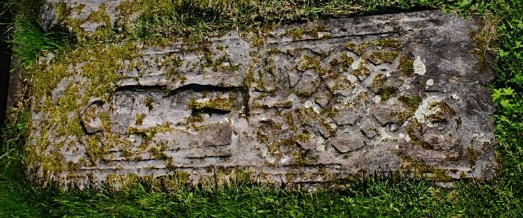 Grave slab in the graveyard.