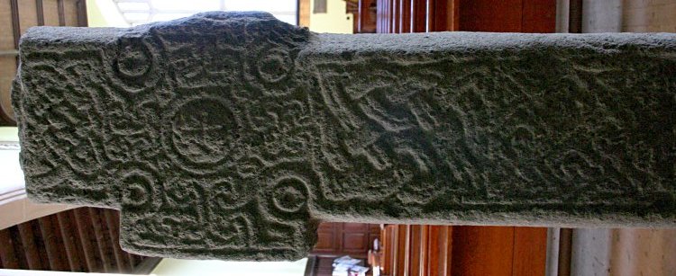Rear of the early Christian cross, now protected inside the church.