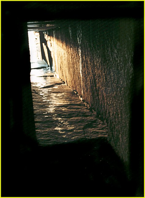  Light from the mid-winter sunset starts to creep down the entrance passage of Maeshowe.