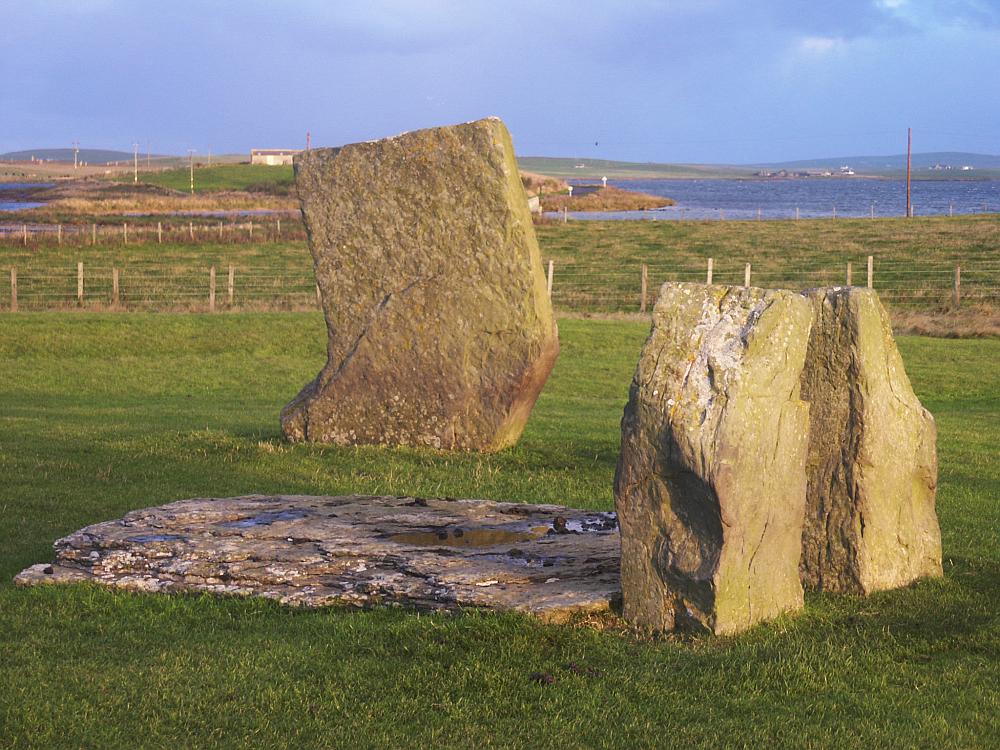 The inner setting of stones with the northern stone behind.  The Ring of Brodgar can just be seen in the distance at the left of the picture.