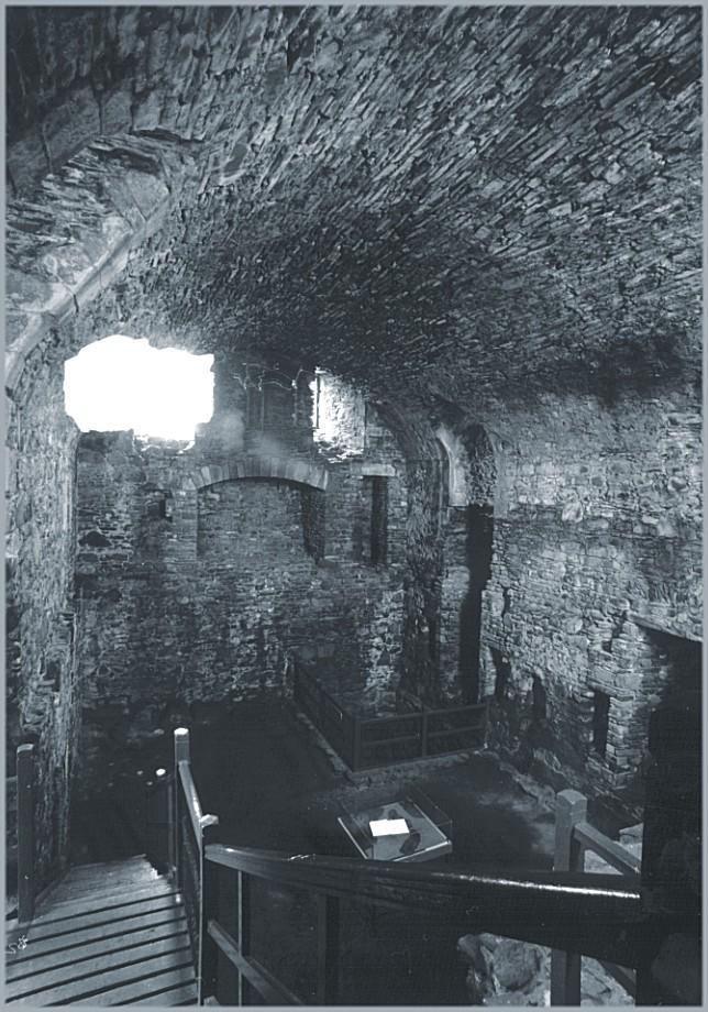 Looking south from the mezzanine to where the kitchen and reception would have been and belon into the cellar.  The large well is fenced off in the far corner.  Below and to the right of the picture is the prison - that must have been unpleasant for the kitchen staff!