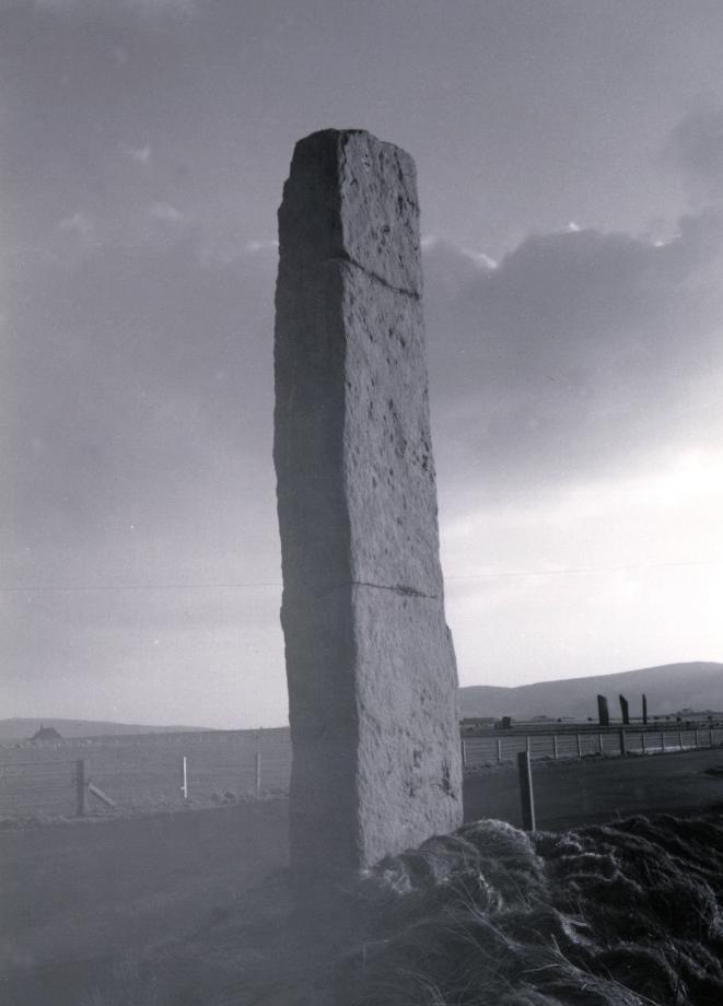 Looking southwest.  The Stones of Stenness can be seen in the distance to the right of the Watch Stone